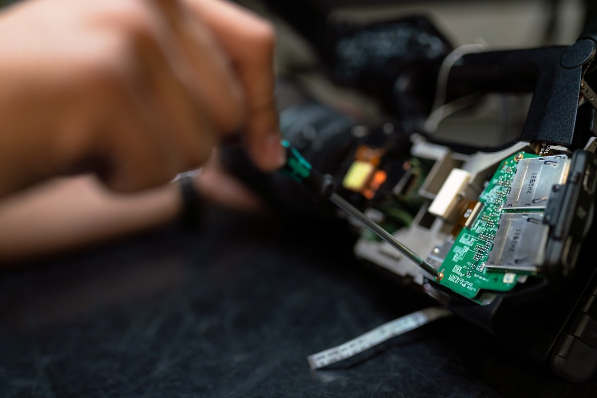 DSLR camera repair in progress on a work bench
