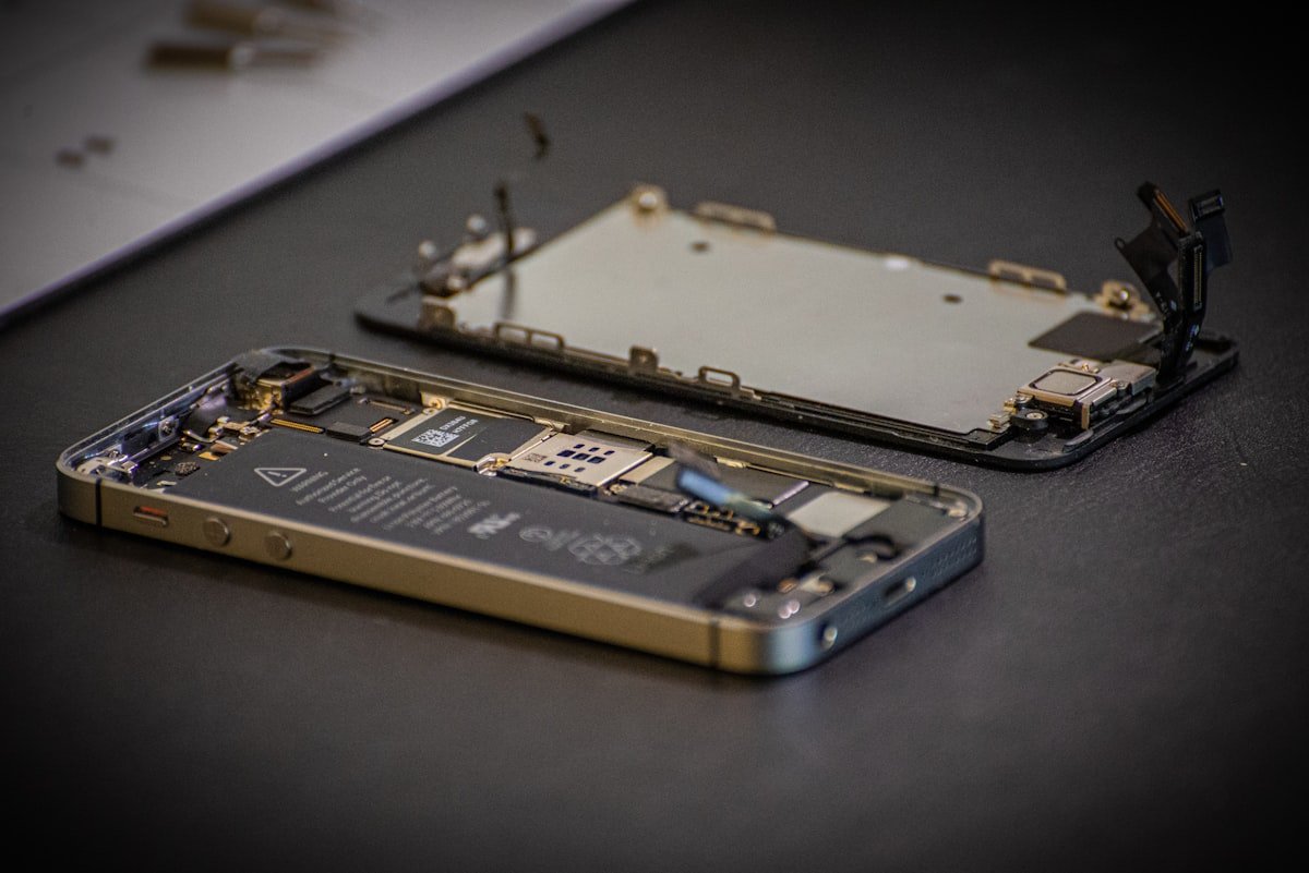 Fitbit smartwatch repair in progress on a work bench